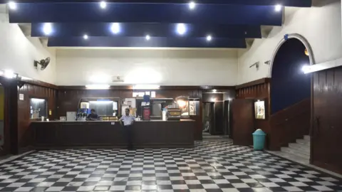 Hindustan Times via Getty Images Regal Theatre, the 85-year-old iconic cinema in the heart of Delhi, shut its doors to moviegoers on Thursday, only to return as a multiplex, on March 30, 2017 in New Delhi, India
