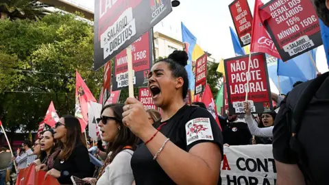 Getty Images People protest against proposed labour laws in Lisbon, Portugal, on 8 November 2025.