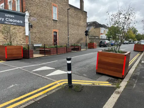 Planter at side of road in LTN with double yellow lines