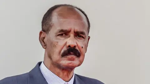 Eritrean President Isaias Afwerki pictured wearing a suit and tie