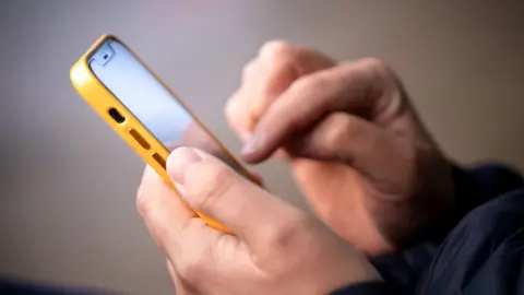 Close up image of man using mobile phone 