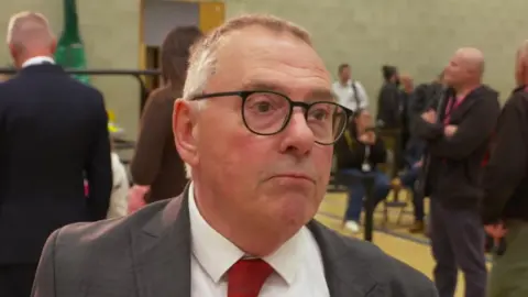 Tudor Evans, Labour leader of Plymouth City Council. He is stood in the hall where the local election count took place.