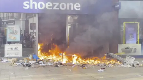 A Shoezone shop on fire