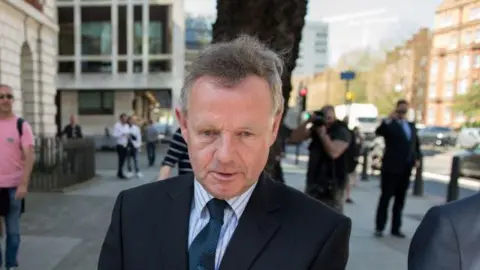 Getty Images Andrew Hill leaves after appearance on manslaughter charge at City of Westminster Magistrates' Court