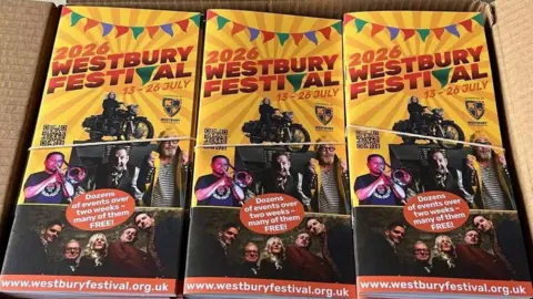 Westbury Festival Leaflets in a box covered with an elastic band