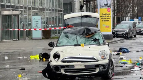 The damaged Mini car which collided with the crowd in Munich