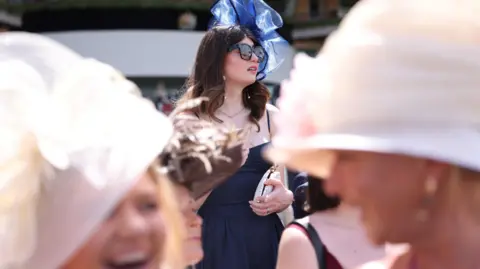 NEIL HALL/EPA/Shutterstock Race-goers attend the first day of Royal Ascot.
