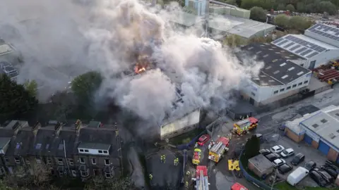 Gazz Hall White smoke billowing from a burning building.