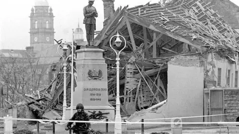 Press Association The aftermath of the Enniskillen Bomb, showing a ruined building and a soldier