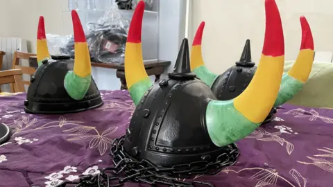 Devil's headwear with chains, the Jab Jab costume