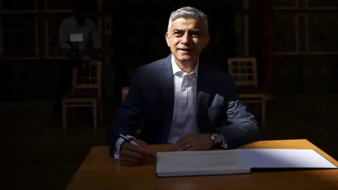 Reuters Mayor of London Sadiq Khan signs in for a second term