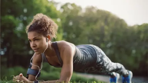 Getty Images Woman doing plank exercise