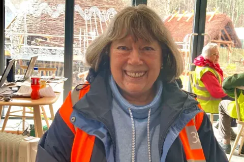 Maureen Kerr, who came in for a book and came out as a volunteer