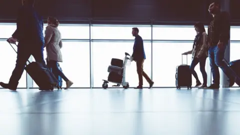 Google People walking through airport