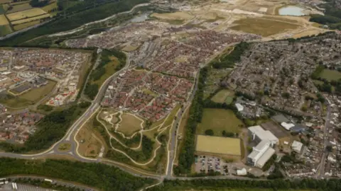 Ebbsfleet Garden City An aerial view shows hundreds homes in a huge sprawling development.