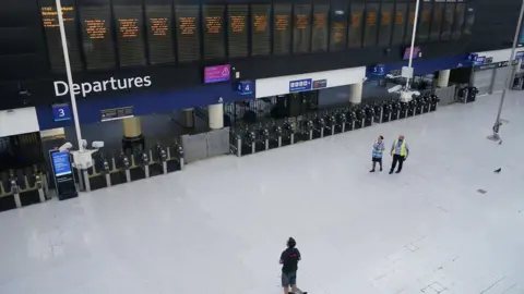 PA Media Commuters during the evening rush hour at Waterloo Station in London on Thursday