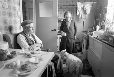 Tom Kidd John and Jeannie with pet lamb, Nesting