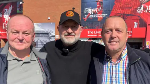 Tony Casey wearing a light grey polo top and navy jacket, Tim Easton wearing a black cap and black polo neck jumper, and Paul Casey wearing a multi-coloured striped shirt and navy coat.