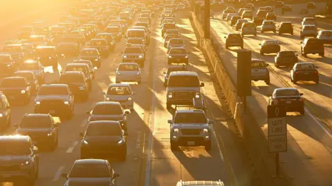 Traffic backs up on Interstate 405 during the morning commute at sunrise on January 15, 2026 in Los Angeles, California