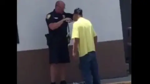 Greg Wallenfelsz Officer Carlson shaving Phil's face