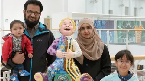 Macdonald Media The Javed family with a cartoon character painted in Ahmar's honour by friends