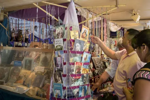 Erica Canepa Tourists browse for cards
