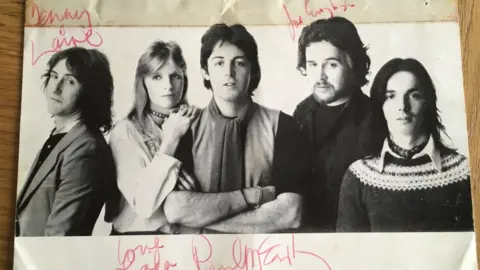 A signed photo of the band Wings