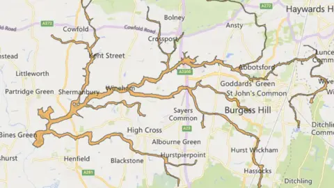 A map of West Sussex showing areas of the River Adur and tributarties highlighted in amber where flooding is possible. 