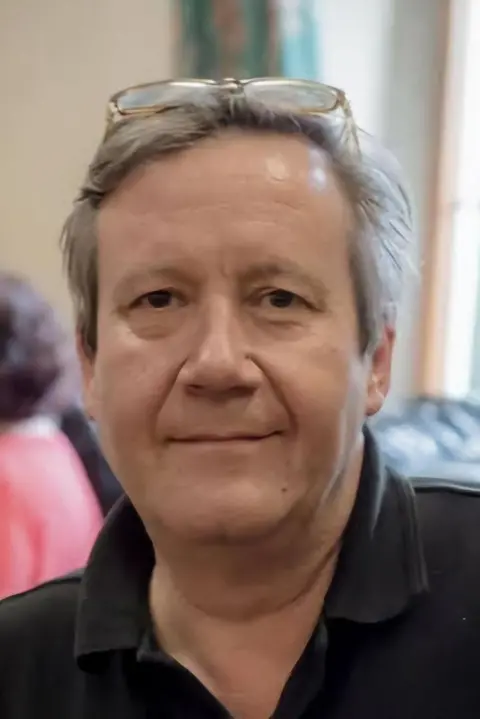 Handout Steve Richardson, who has grey hair, dark eyes and is wearing a black polo shirt. He is smiling in the photo.