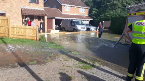 MK Council The fire brigade tackling the flooding in Neath Hill, Milton Keynes