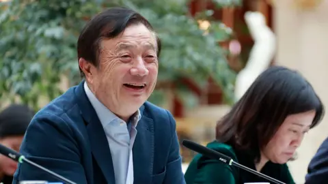 AFP/Huawei Huawei founder Ren Zhengfei (L) speaking to Chinese media in Shenzhen