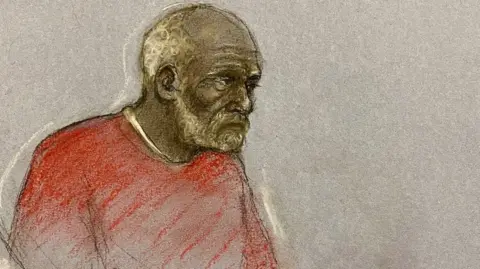 PA Ryland Headley wearing a red jumper in a court sketch