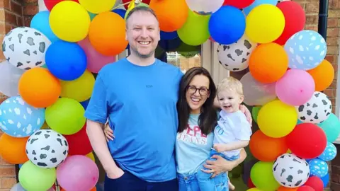 Family Claire with her husband and two-year-old son George