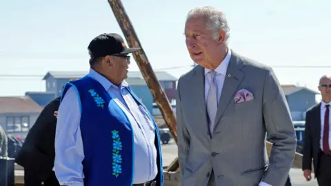 Getty Images Prince Charles, Prince of Wales and Chief Edward Sangris (Dettah) participate in a Feeding the Fire Ceremony, facilitated by Elder Bernadette Martin on day three of their Platinum Jubilee Royal Tour