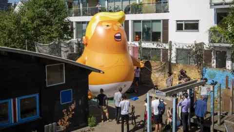 Andrew Aitchison inflatable baby at Martin Luther King adventure playground in Islington