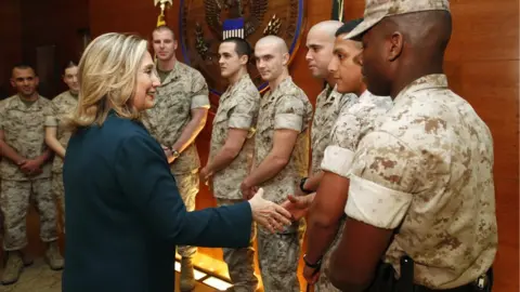 AFP Hilary Clinton shakes hands with US troops on a visit to Afghanistan in 2011.