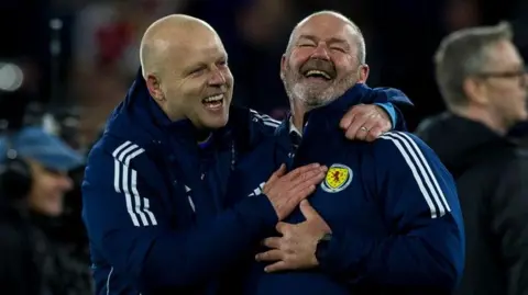 Scotland's Steven Naismith and Steve Clarke celebrate World Cup qualification