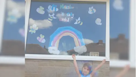 Leeanne Ogden Bees and rainbow in window