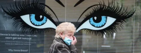 PA Media Woman in mask