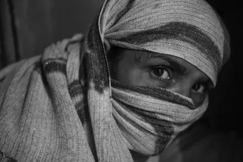 Mukeshdevi veils her face and hair with her dupatta