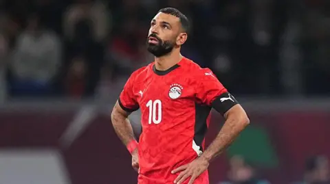 Mohamed Salah looks on sadly after Egypt's Afcon semi-final loss