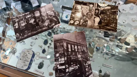 Three old black and white photographs showing people behind a market stall