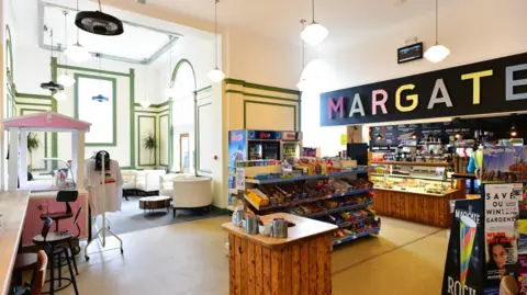 A picture of a café in Margate station, with Margate written in different colour letters above the kiosk of the café