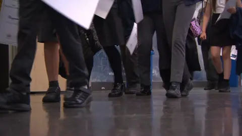 BBC Children walking in school hallway