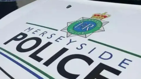 A close-up photo of a Merseyside Police car