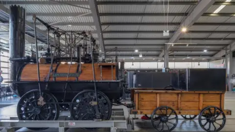 An image of an old steam train in a museum.