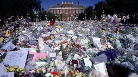 PA Floral tributes outside Kensington Palace following the death of Princess Diana