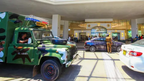 Getty Images Bomb disposal outside the Cinnamon Grand hotel