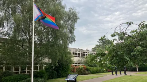A multi-coloured LGBTQ+ flag was flying outside County Hall