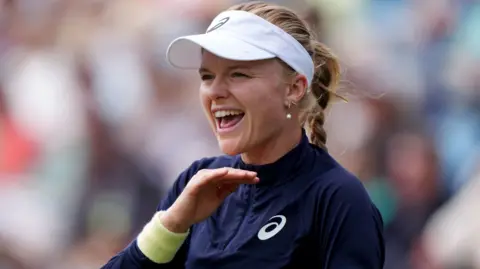 Harriet Dart gestures to her team in her loss to Barbora Krejcikova